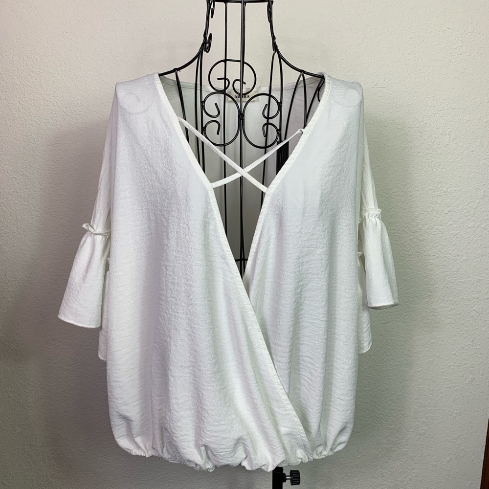 Adora blouse. Crossover front with sewn bottom